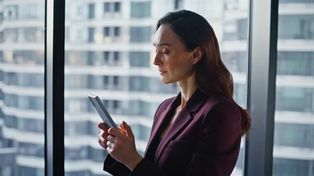Closeup lawyer texting smartphone answering clients alone at panoramic window