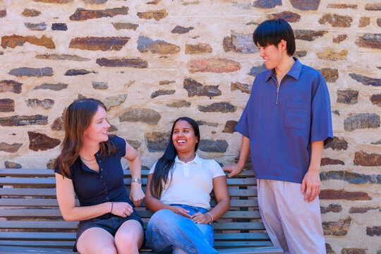University Students Talking on a Bench at an Australian Campus