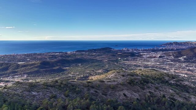 Coastal Plain To Sea Panorama With Distant Skyline And Clear Azure Water, Rolling Scrubland In Foreground,