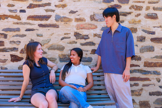 University Students Talking on a Bench at an Australian Campus