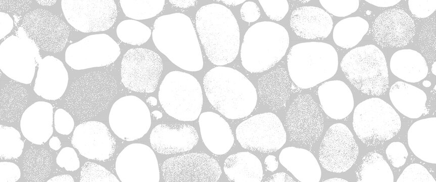 Abstract pattern of smooth white pebbles and textured grey pebbles on a light grey background stone rock