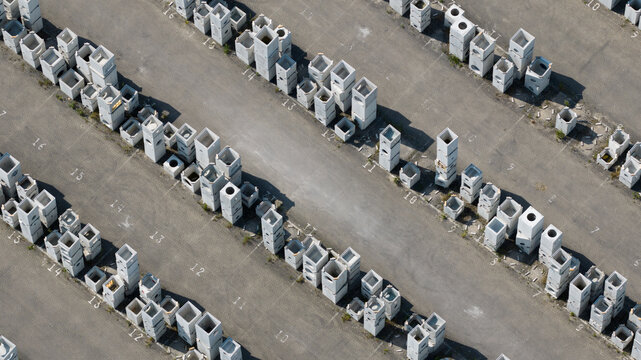 Aerial view of stacks of concrete blocks arranged in numbered rows in an industrial storage yard in Oosterhout, North Brabant, Netherlands.