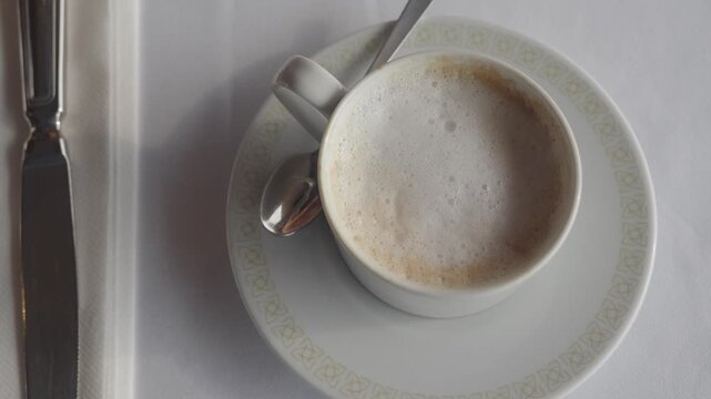 Cafe drink in cup on white table