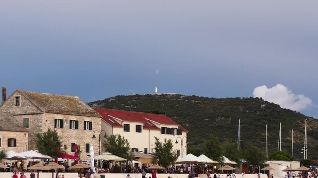 PRIMOSTEN, CROATIA - JULY 25 2017: Our Lady of Loreto monument on mountain. Primosten (Capocesto) is village and municipality in Sibenik-Knin County, Croatia on Adriatic coast. Evening time.