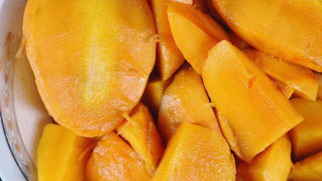 Sweet mango slices in a clean bowl ready for serving