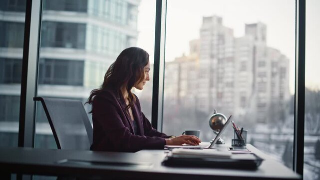 Attractive lady employee working computer at office closeup. Woman taking break