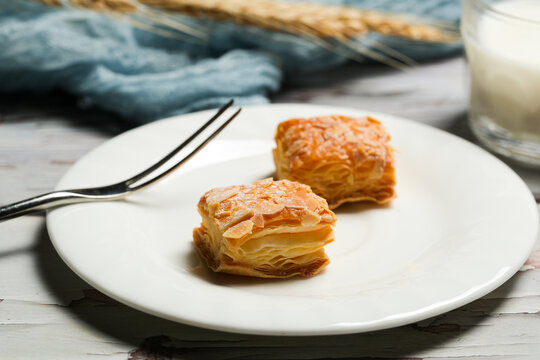 Almond Flaky Pastry Slices with Milk Glass