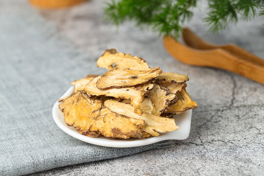 Dried Angelica Sinensis Slices on White Plate