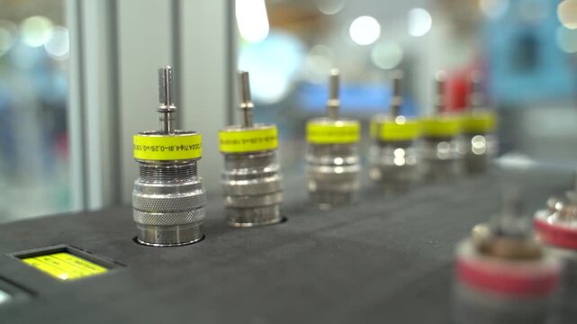 Close side view of metal tooling inserts seated in a foam organizer