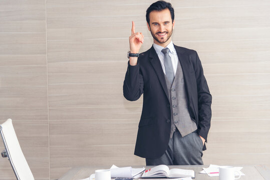 Portrait caucasian man businessman smiling face confident leader manager in meeting rooom office desk. Caucasian handsome man success look away thinking poses. Happy positive Handsome CEO