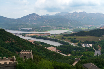 Fototapeta premium A Fragment of the Great Wall in the Nanshan scenic area of the Jiaodong Peninsula on a sunny summer day, Longkou, Yantai, Shandong, China