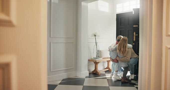 Hug, children and dad in home for greeting, anticipation and care for homecoming. Daughters, father and embrace by front door for welcome, family reunion and bonding together for parent arrival