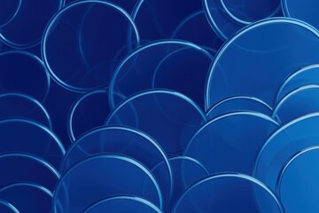 Obraz premium Blue circles overlap creating abstract pattern. Shades vary, suggesting depth, texture. Clean design, modern aesthetic.