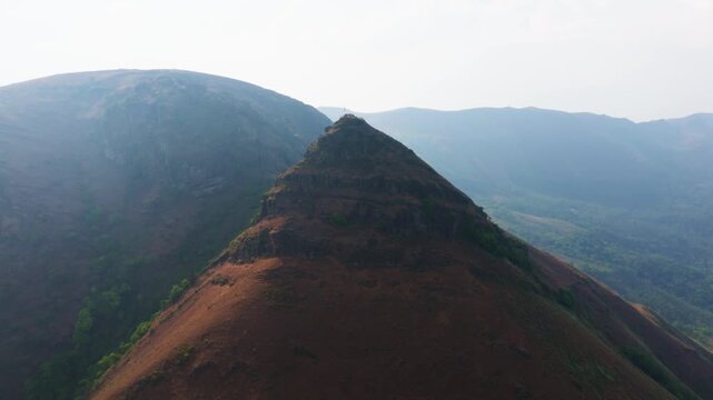 Aerial view of Chandra Drona Parvatha with fog, greenery, sky and hill station at Western Ghats, Baba Budangiri, Chikkamagaluru, karnataka, india. day time, push in shot, drone shot, 4k.