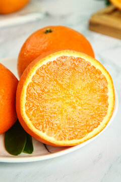 Fresh Sliced Oranges with Citrus Flesh on White Plate
