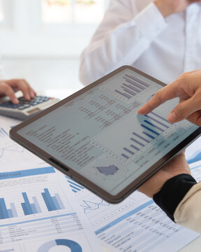 Finance Investment consultant analyze data insight and financial planning strategy for investment portfolio growth.