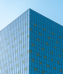 Obraz premium Modern Office Building Glass Curtain Wall Facade with Blue Windows