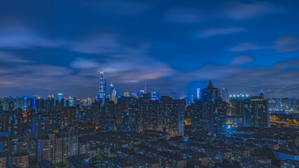 Fototapeta premium Shanghai Skyline Night View with Illuminated Skyscrapers