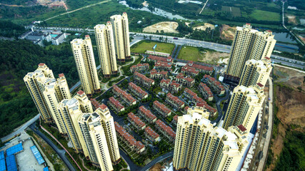 Aerial View of Modern High-Rise and Traditional Housing Development © TrinhVan