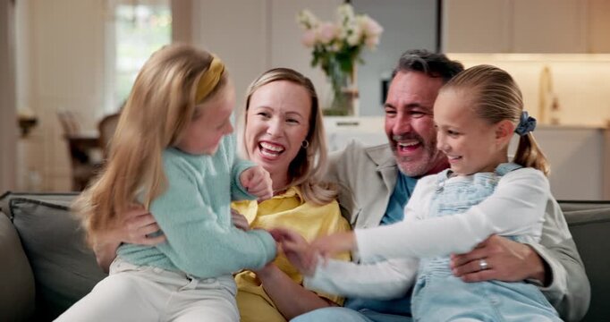 Tickle, girls and smile with parents in home for care, support or connection together on sofa. Children, daughters and embrace with laughing in living room for family bonding, playing and funny joke