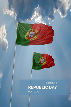 Two flags of Portugal in blue sky with clouds for National holiday