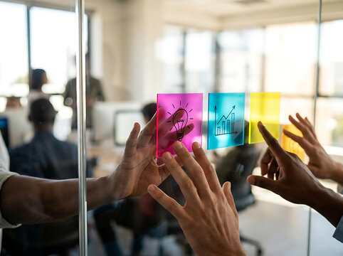 Diverse Professional Team Brainstorming Strategy and Creative Concepts on Glass Office Board
