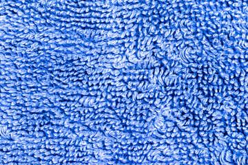 Soft blue terry towel fabric texture close-up background of absorbent cotton textile material structure macro. © Александр Серебрянни