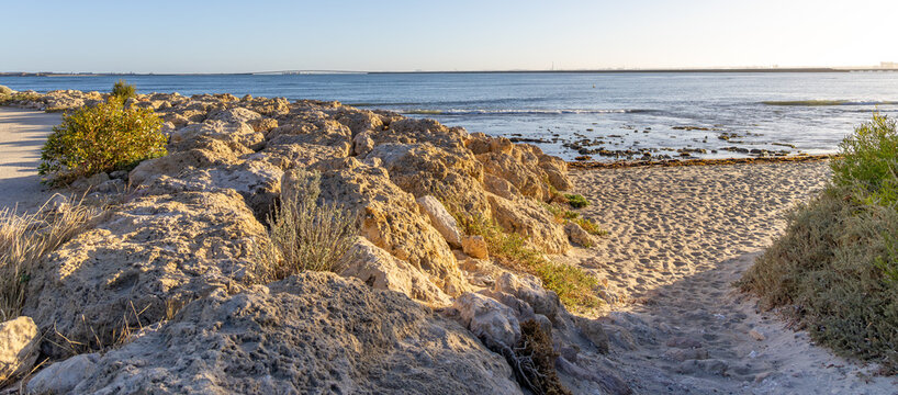 Point Peron beach East, looking towards the Garden Island causeway and military base. Rockingham Western Australia.