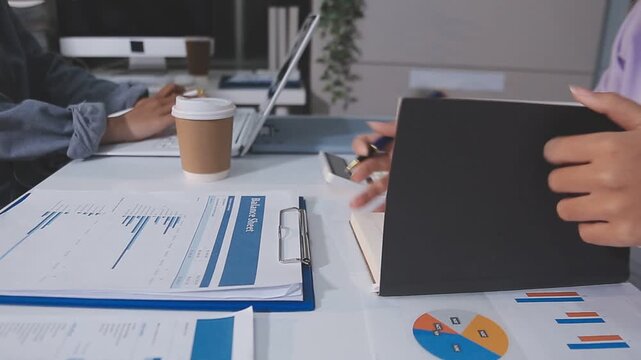 Business accounting concept, Business man using calculator with computer laptop, budget and loan paper in office.