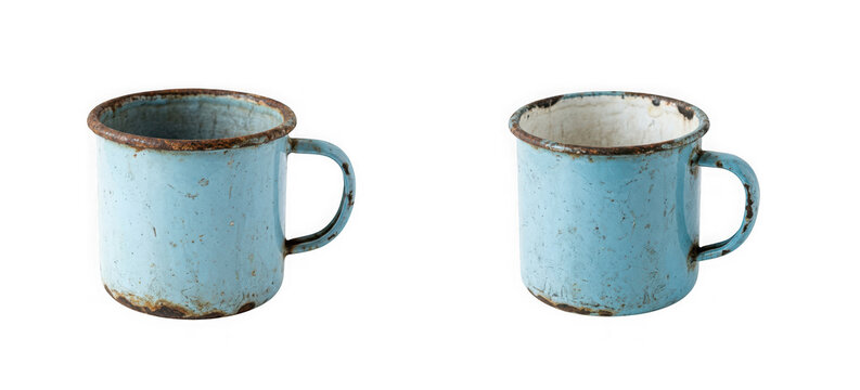 Two matching rustic blue enamel metal mugs isolated on transparent background