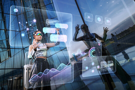 Woman in futuristic clothes interacts with holographic interface