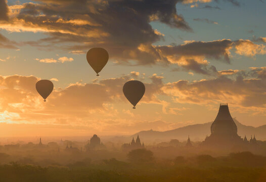 Hot balloon over temple pagoda on during Sunrise Myanmar