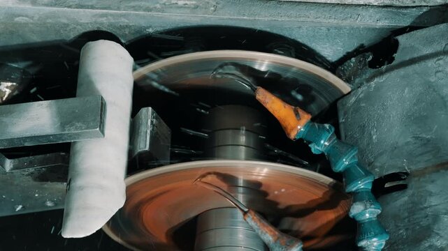 Double-Disc Grinding Machine with Coolant Spray in Metalworking Workshop