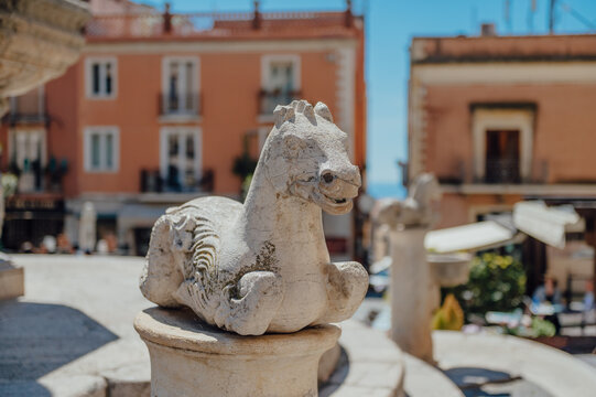 Stone seahorse sculpture on the Baroque fountain in Piazza Duomo