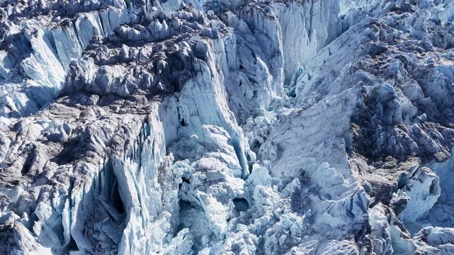 Aerial close up of a heavily crevassed glacier