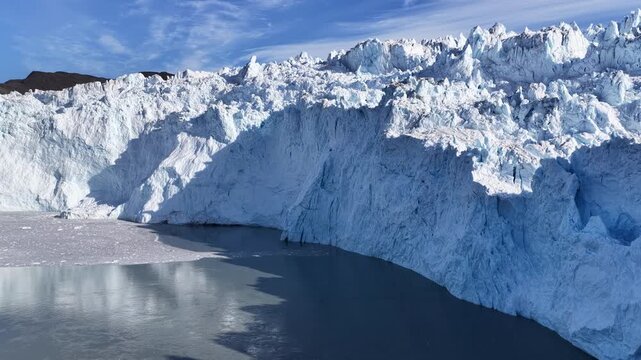Drone flying along a majestic glacier wall