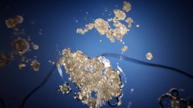 Acetylsalicylic acid dissolving in water under microscope, chemical reaction macro