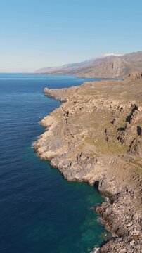 Crete island coastline in the Mediterranean Sea, on a sunny day of summer, aerial view

