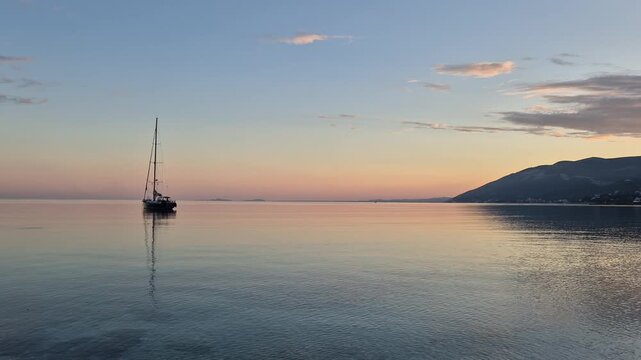 Albania offers a stunning backdrop with views of Orikum. Savor the calmness of the sea as boats drift gently while the warm sun sets over the horizon. A perfect spot for relaxation.