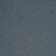Fototapeta premium Textured dark blue paper background with a subtle grainy appearance.