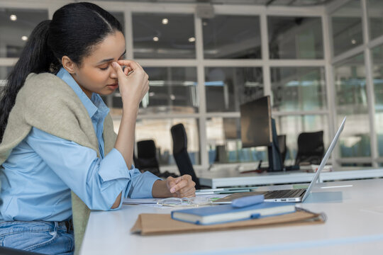 Stressed woman suffering from migraine