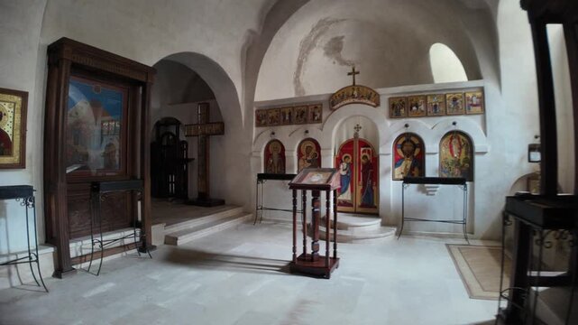 Vardzia, Georgia, May 1, 2025: David Gareji monastery interior featuring ancient orthodox icons, an altar, and a lectern, highlighting spiritual history in Georgia