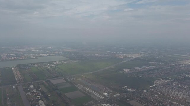 aerial footage of flying in the sky with some clouds over green landscape view. aerial view of cloud in sky in natural nature background flying in the sky above countryside area