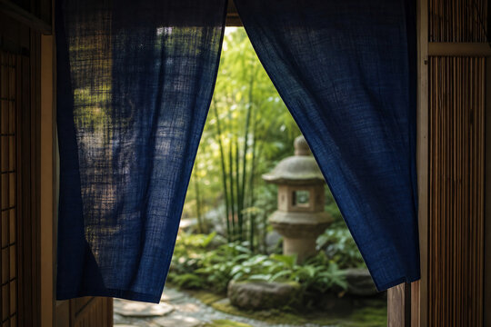 Traditional Japanese noren doorway curtain summer garden view through fabric