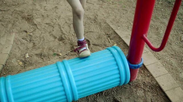 Little girl are engaged on sports apparatus