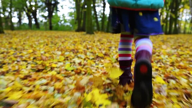 Little beautiful girl on autumn city park