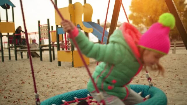 Beautiful little girl on swing