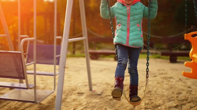 Beautiful little girl on swing