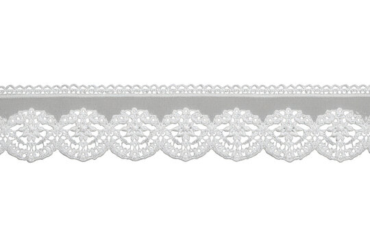 White lace border trim with intricate patterned embroidery detailing elegant vintage textile design
