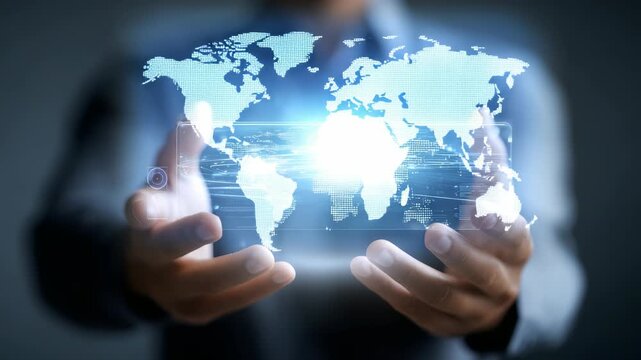 A person presents a glowing virtual map of the world, representing global communication and digital transformation. Modern technology and network concepts are visually emphasized in this image
